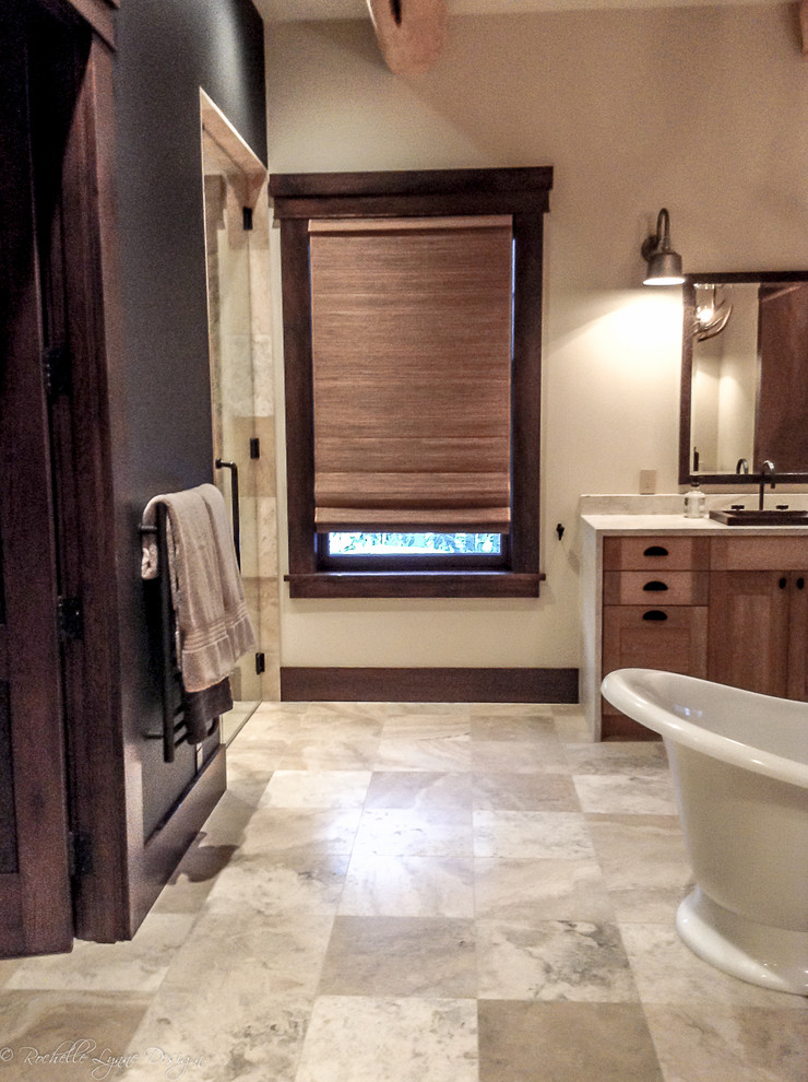 Huge mountain style master travertine floor walk-in shower photo in Calgary with shaker cabinets, light wood cabinets, beige walls, a drop-in sink and granite countertops