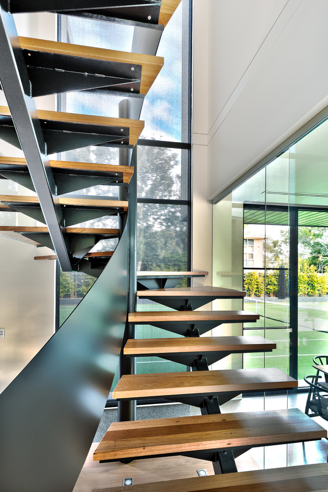 Inspiration for a contemporary wood staircase in Melbourne with open risers.