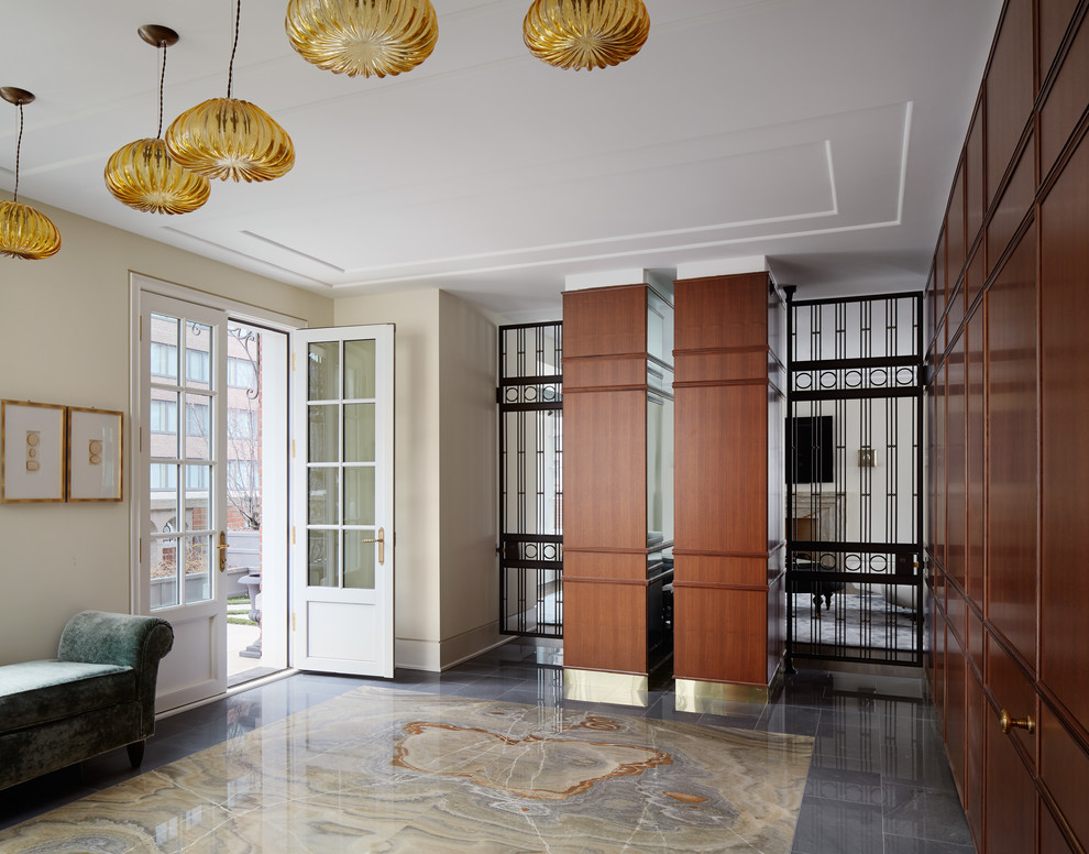 Inspiration for a huge transitional foyer remodel in Chicago with beige walls and a metal front door