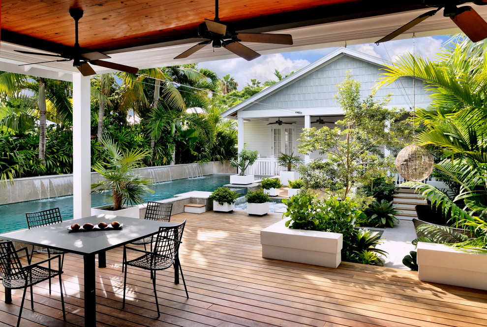 Beach style backyard deck in Miami.