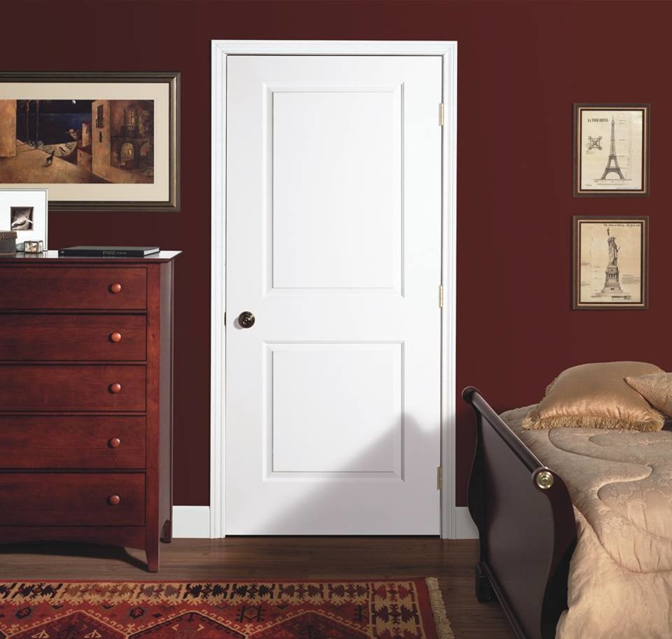 This is an example of a mid-sized traditional master bedroom in Other with red walls, medium hardwood floors and brown floor.