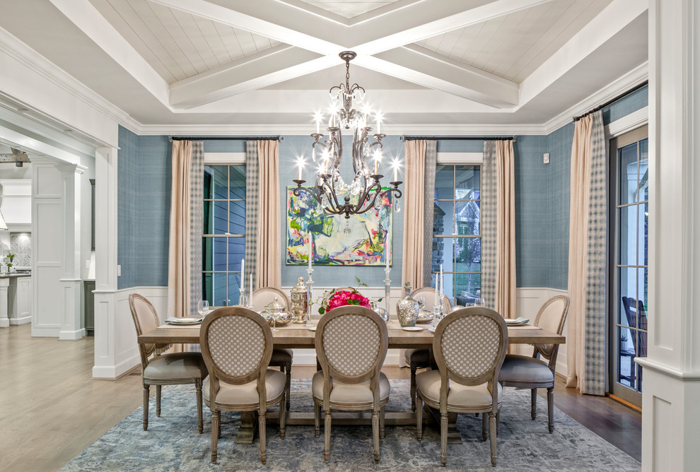 Photo of a transitional dining room in Cincinnati with blue walls, dark hardwood floors and brown floor.