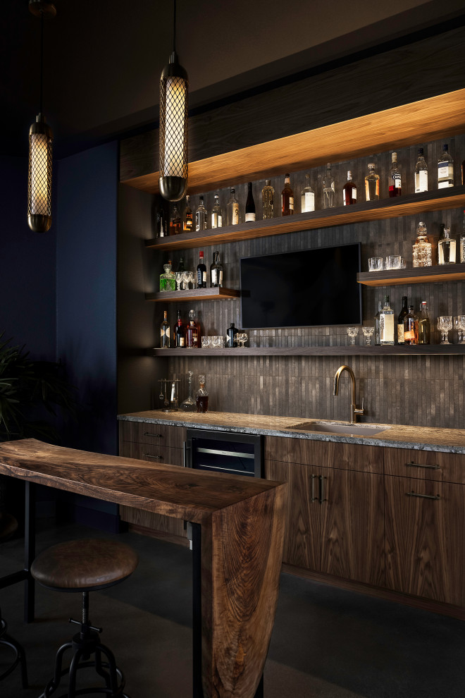 Large single-wall wet bar in Sacramento with an undermount sink, dark wood cabinets, quartz benchtops, multi-coloured splashback, porcelain splashback, concrete floors, blue floor and multi-coloured benchtop.