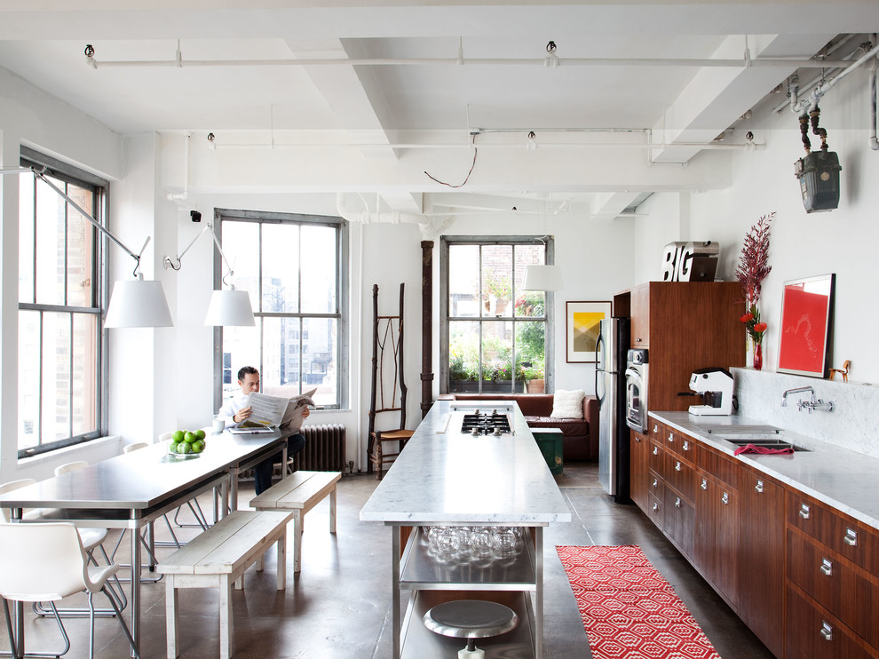 Industrial kitchen in New York with stainless steel appliances.