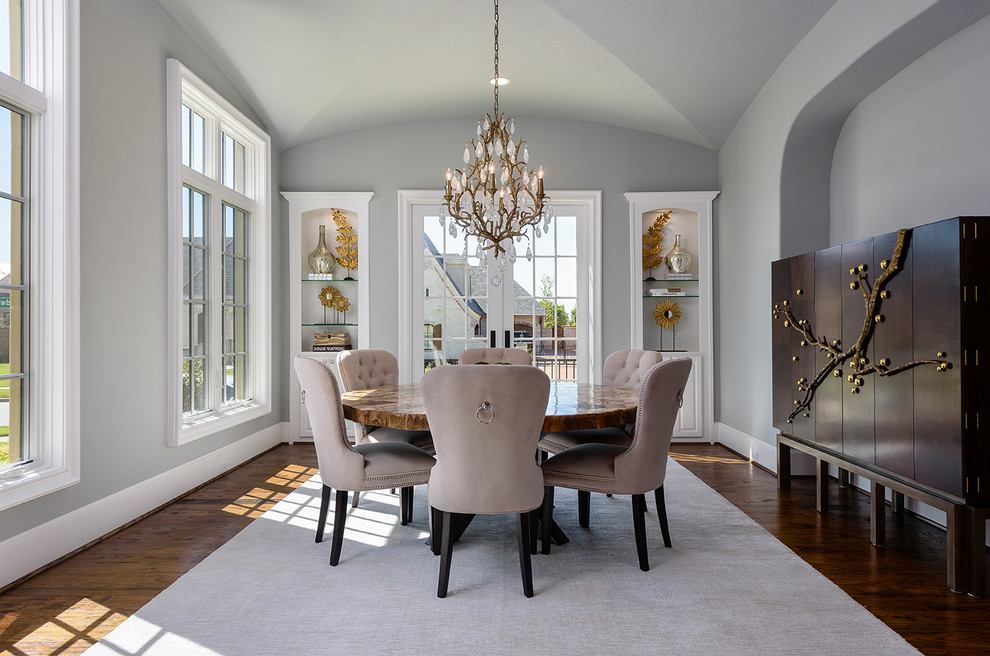 Transitional separate dining room in Dallas with grey walls, medium hardwood floors and brown floor.