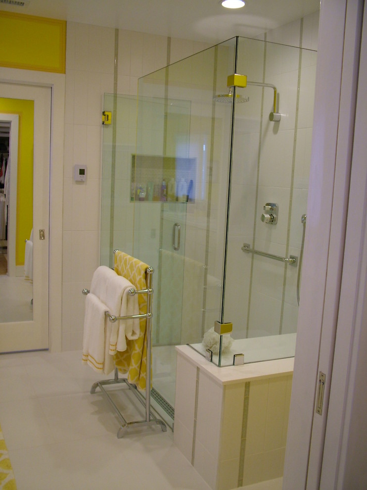 This is an example of a mid-sized contemporary master bathroom in San Diego with a drop-in sink, flat-panel cabinets, white cabinets, engineered quartz benchtops, a curbless shower, a one-piece toilet, white tile, porcelain tile, yellow walls and porcelain floors.
