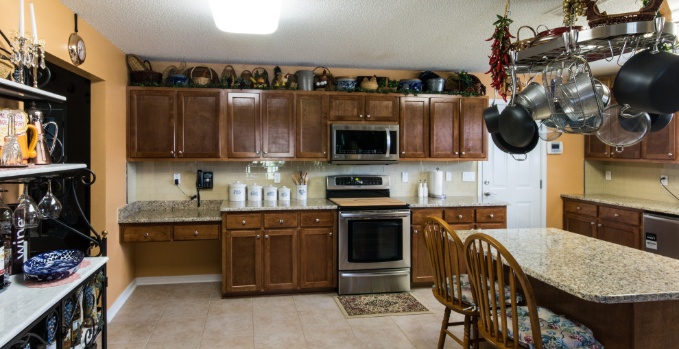 Inspiration for a large l-shaped ceramic tile and beige floor eat-in kitchen remodel with an undermount sink, flat-panel cabinets, brown cabinets and an island