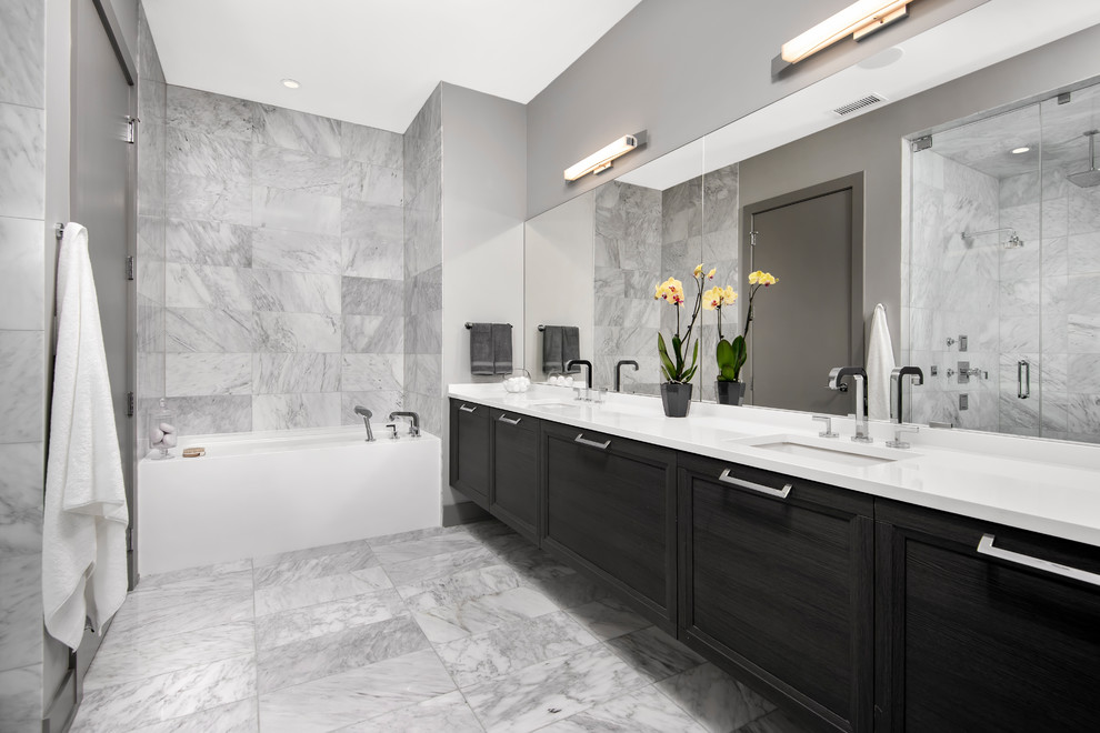 Design ideas for a transitional master bathroom in Chicago with black cabinets, gray tile, white benchtops, recessed-panel cabinets, an alcove tub, an alcove shower, grey walls, an undermount sink, grey floor and a hinged shower door.