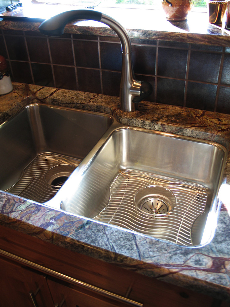 Eat-in kitchen - large transitional u-shaped eat-in kitchen idea in New Orleans with a double-bowl sink, medium tone wood cabinets, marble countertops, brown backsplash, ceramic backsplash, stainless steel appliances and no island