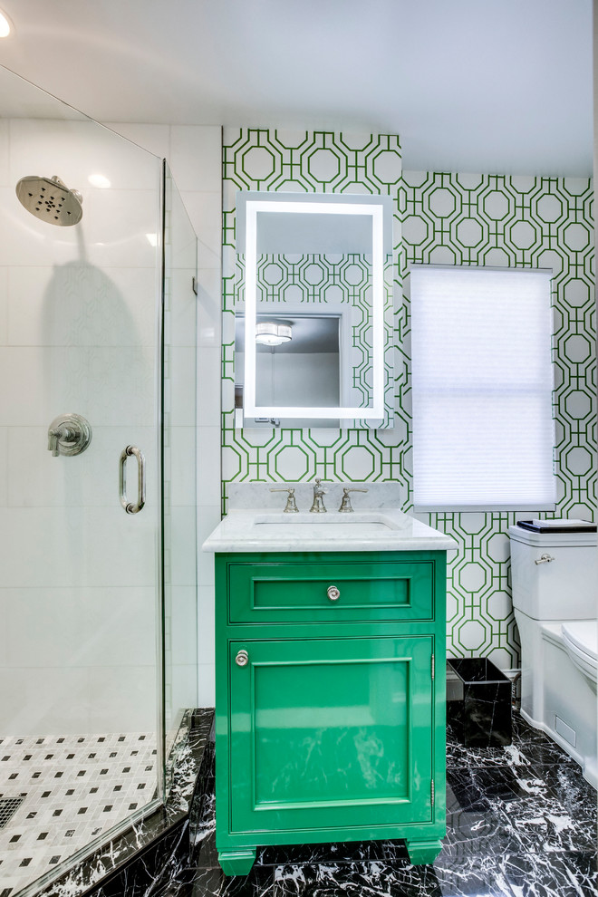 Inspiration for a small transitional 3/4 bathroom in DC Metro with beaded inset cabinets, green cabinets, a corner shower, white tile, marble, marble floors, an undermount sink, marble benchtops, black floor, a hinged shower door, white benchtops, a two-piece toilet and multi-coloured walls.