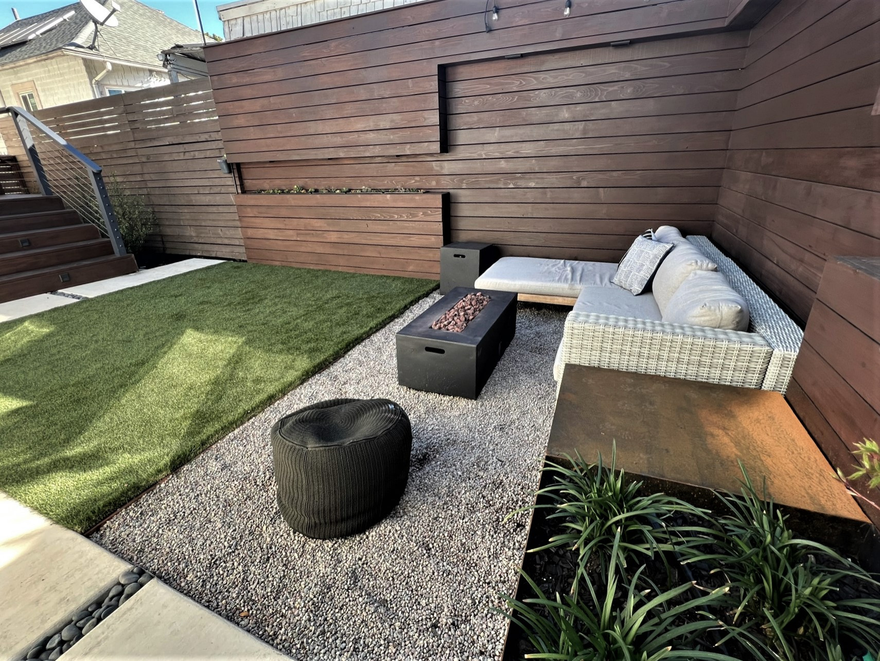 Architectural fence with built-in lights and planters