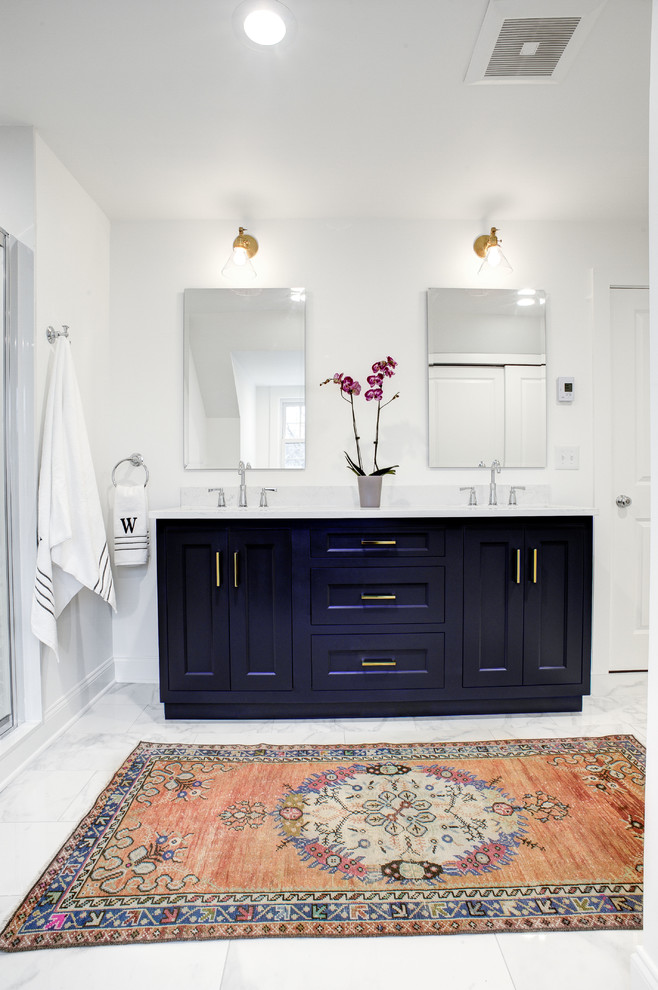 Mid-sized contemporary master bathroom in Philadelphia with shaker cabinets, an alcove shower, a two-piece toilet, white tile, porcelain tile, white walls, an undermount sink, a hinged shower door, white benchtops, purple cabinets, marble floors, marble benchtops and white floor.
