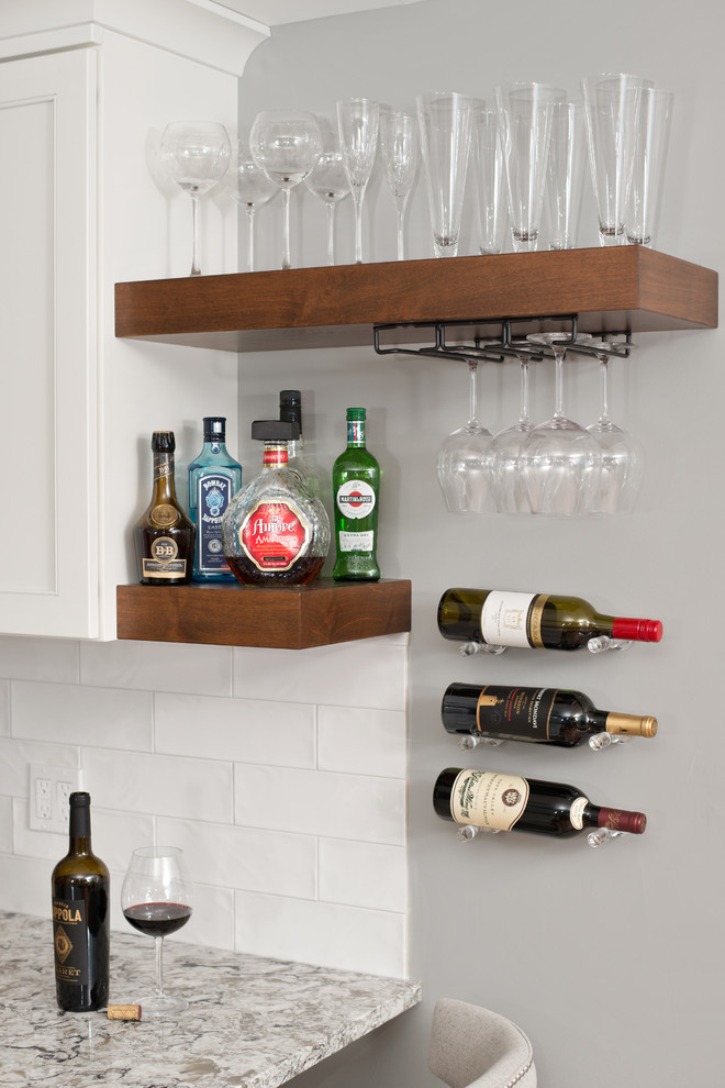 Transitional l-shaped vinyl floor and brown floor eat-in kitchen photo with an undermount sink, beaded inset cabinets, white cabinets, quartz countertops, white backsplash, ceramic backsplash, stainless steel appliances and multicolored countertops