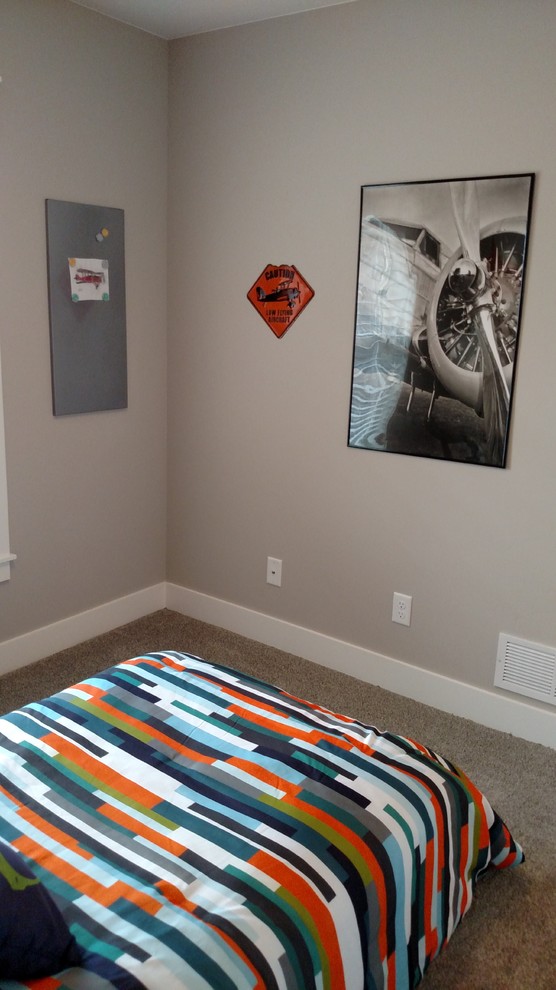 Mid-sized modern guest bedroom in Other with grey walls and carpet.