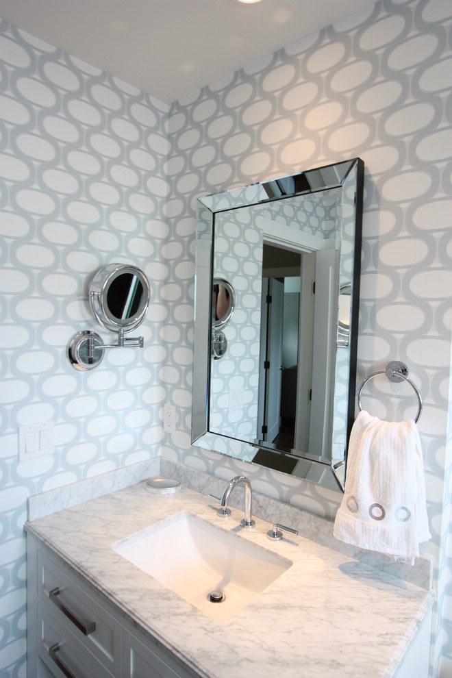 Small transitional kids bathroom in Vancouver with an undermount sink, shaker cabinets, white cabinets, marble benchtops, a shower/bathtub combo, a one-piece toilet, white tile, subway tile, white walls and porcelain floors.