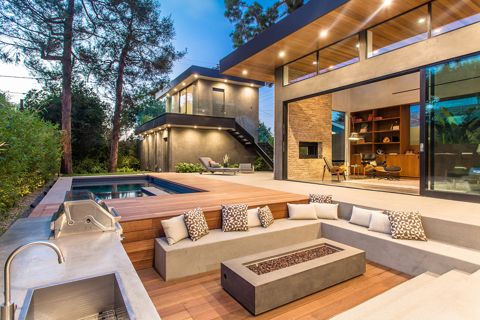 Design ideas for a contemporary backyard patio in Los Angeles with an outdoor kitchen, decking and no cover.