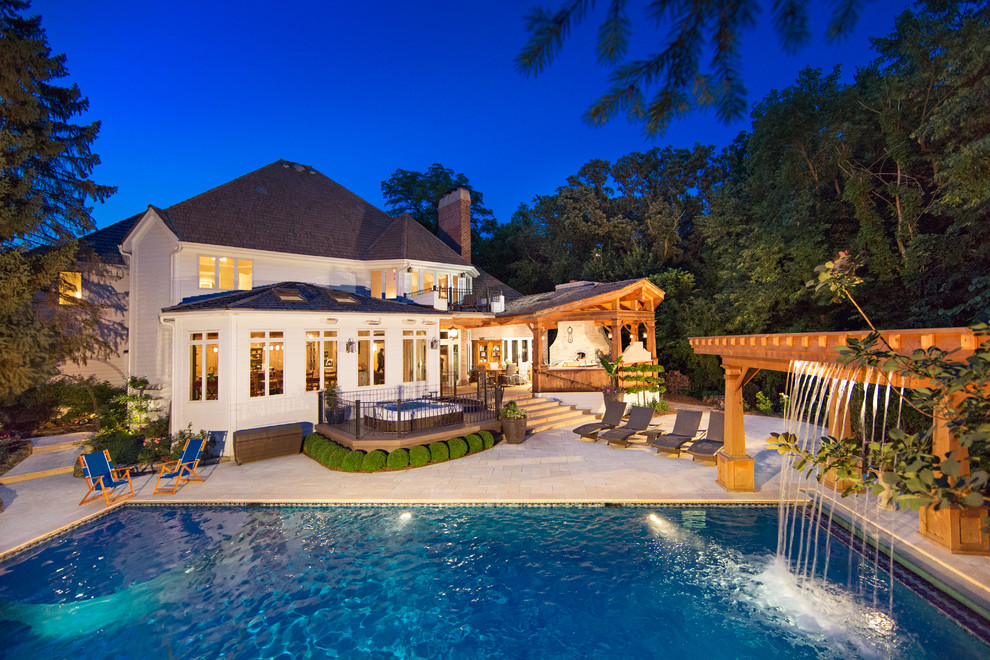 Hot tub - large traditional backyard tile and rectangular natural hot tub idea in Chicago