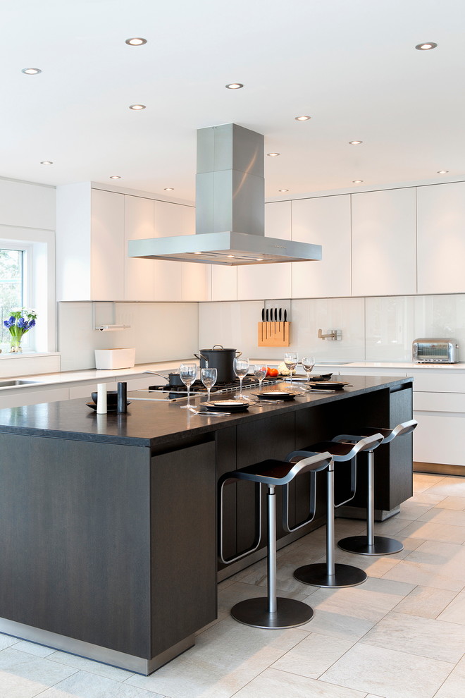Design ideas for a large contemporary l-shaped eat-in kitchen in New York with a single-bowl sink, flat-panel cabinets, white cabinets, marble benchtops, white splashback, glass sheet splashback, stainless steel appliances, ceramic floors and with island.