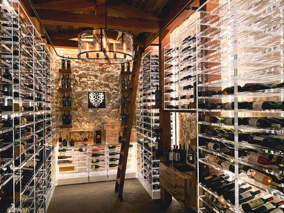 Design ideas for a large industrial wine cellar in San Francisco with brick floors, storage racks and grey floor.