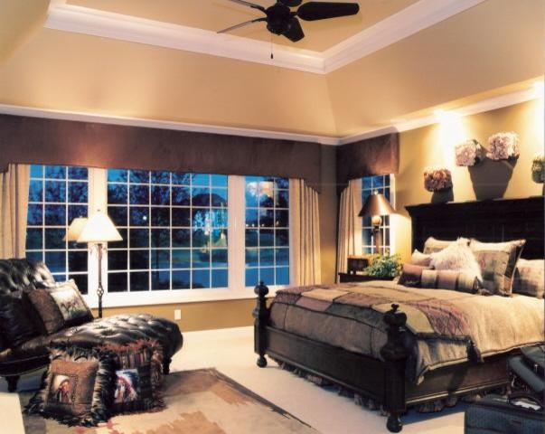 Large mountain style master carpeted bedroom photo in Cincinnati with beige walls and no fireplace