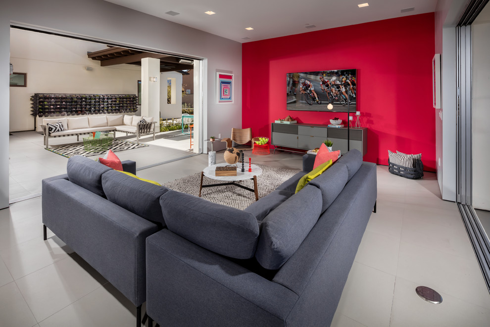 Family room - contemporary family room idea in Los Angeles with red walls
