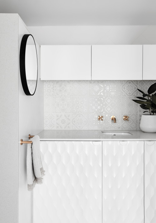 Chic Patterns: All-White Bathroom with Damask Patterned Backsplash for White Bathroom with Gold Fixtures