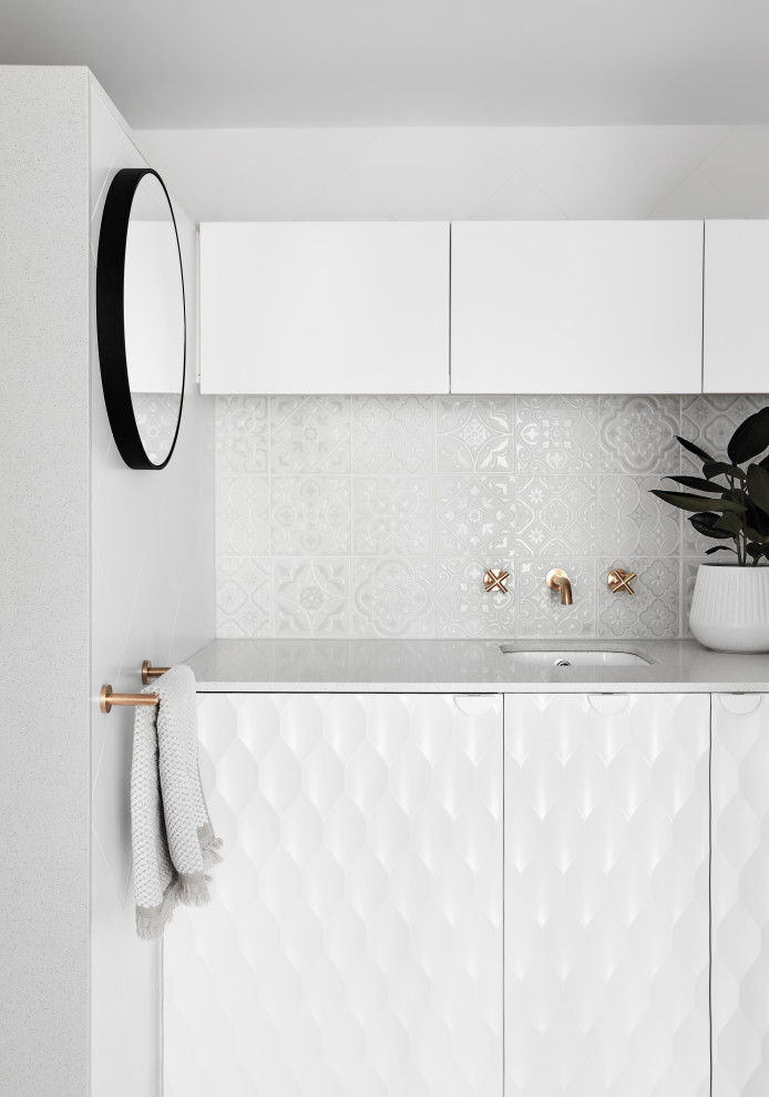 Inspiration for a mid-sized contemporary bathroom in Melbourne with white cabinets, white tile, white walls, an undermount sink, white benchtops, a single vanity and a built-in vanity.