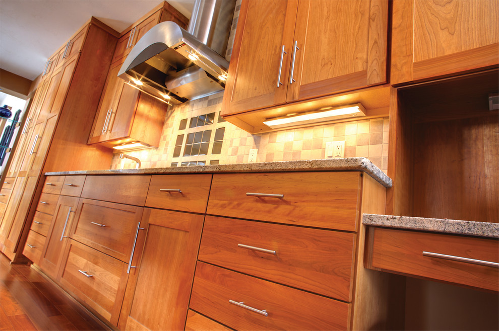 Large transitional l-shaped eat-in kitchen photo with shaker cabinets, light wood cabinets, granite countertops, stainless steel appliances and an island