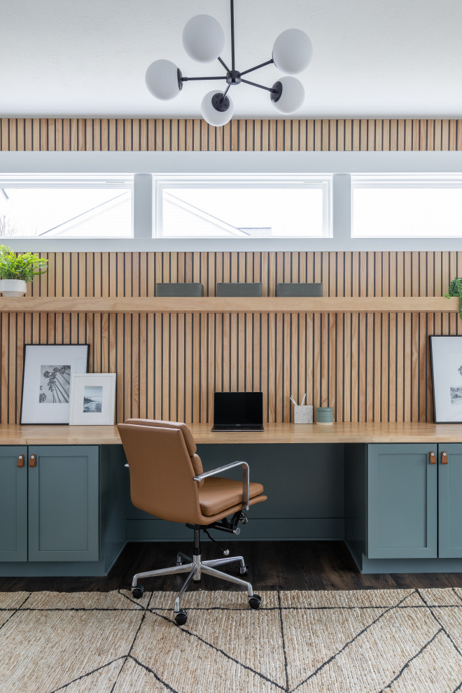 This is an example of a midcentury home office in Grand Rapids.