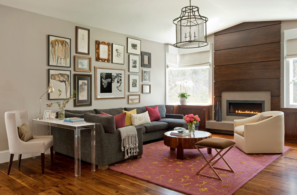Design ideas for a large contemporary family room in San Francisco with a wood fireplace surround, grey walls, dark hardwood floors, a ribbon fireplace and grey floor.