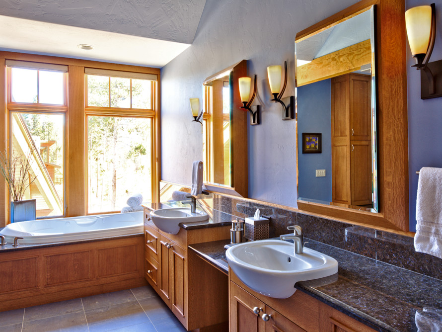 Drop-in bathtub - large modern master porcelain tile and blue floor drop-in bathtub idea in Denver with blue walls, a drop-in sink, granite countertops and black countertops