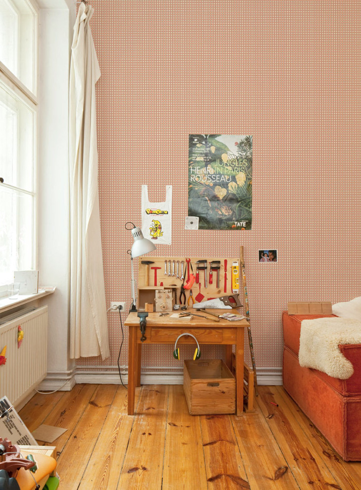 Inspiration for a large traditional gender-neutral kids' playroom for kids 4-10 years old in Berlin with multi-coloured walls and dark hardwood floors.