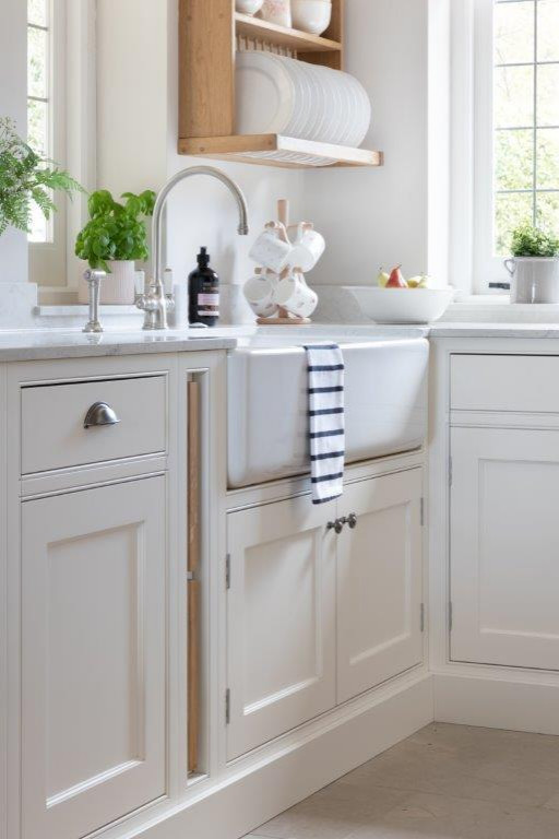 Inspiration for a large transitional eat-in kitchen in Hampshire with a farmhouse sink, shaker cabinets, grey cabinets, wood benchtops, stone tile splashback, panelled appliances, limestone floors, with island, beige floor and grey benchtop.