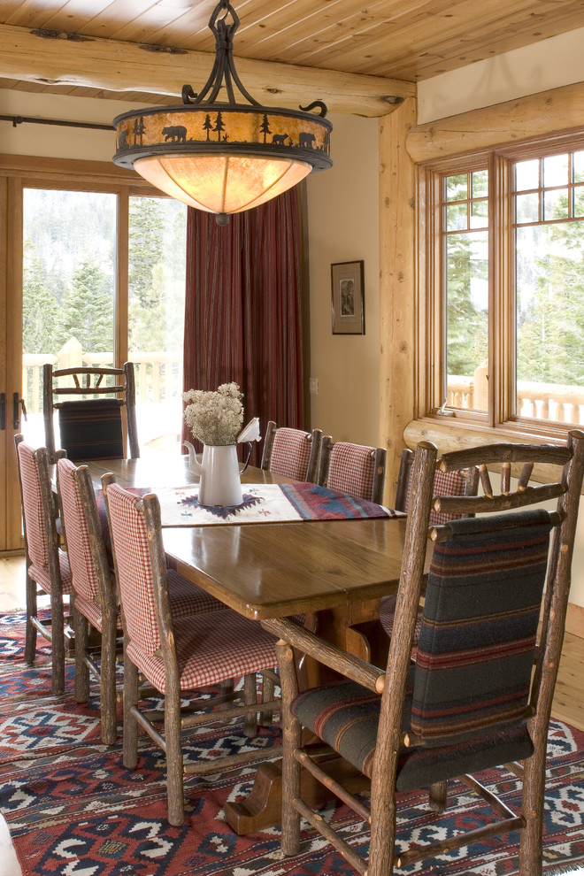 Design ideas for a country dining room in San Francisco with beige walls and dark hardwood floors.