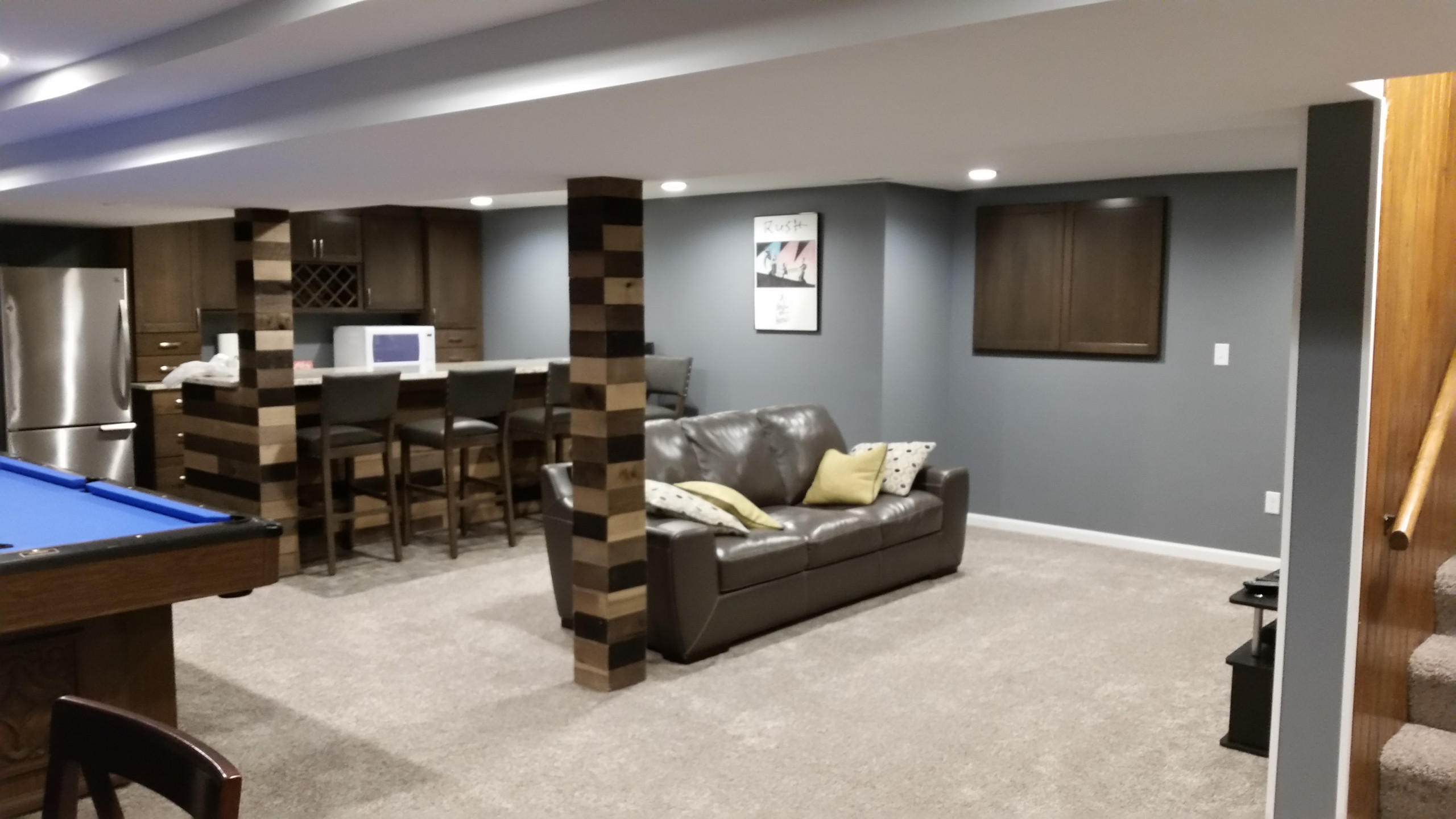 Basement rec room with custom bar and bedroom