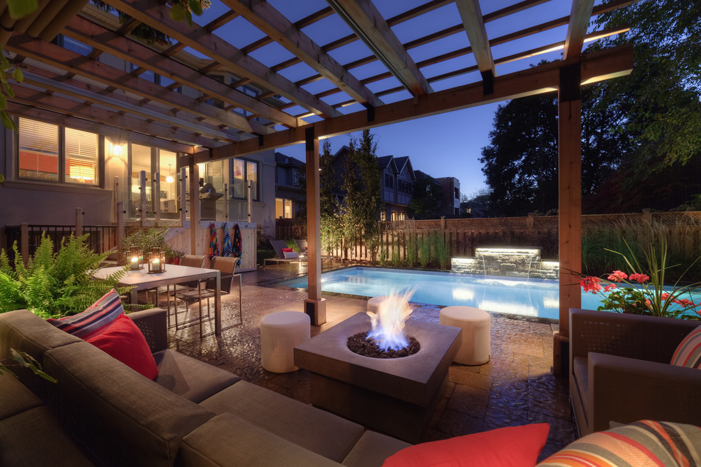 Traditional patio in Toronto with a pergola.