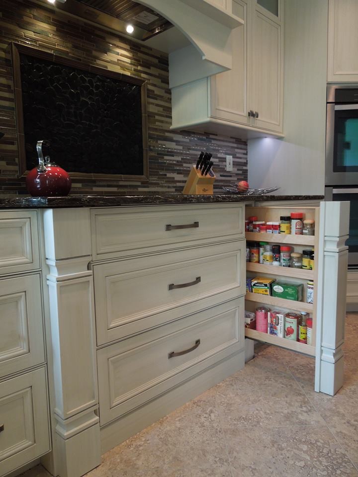 Example of a large l-shaped porcelain tile eat-in kitchen design with a double-bowl sink, beaded inset cabinets, white cabinets, marble countertops, brown backsplash, matchstick tile backsplash, stainless steel appliances and an island