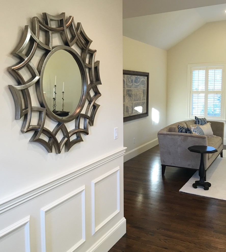 Mid-sized transitional medium tone wood floor front door photo in Boston with white walls