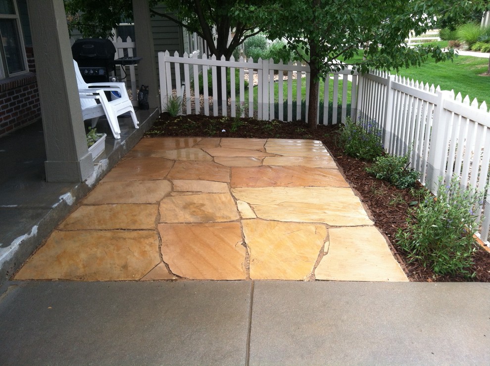 Example of a mountain style patio design in Denver