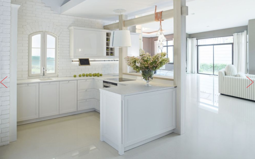 Photo of a small modern u-shaped separate kitchen in Austin with a drop-in sink, shaker cabinets, white cabinets, zinc benchtops, white splashback, stone tile splashback, panelled appliances, porcelain floors, with island, white floor and white benchtop.