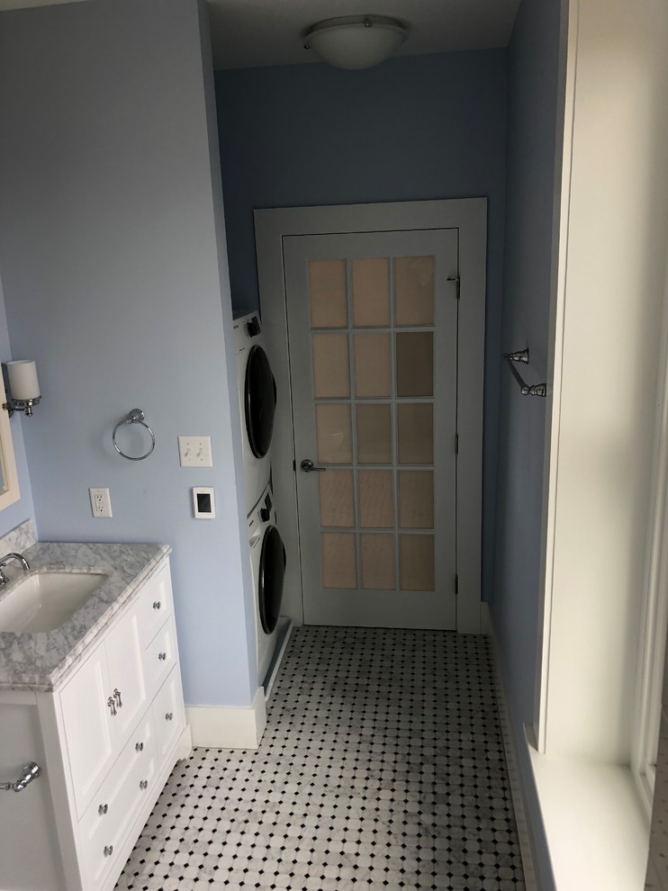 Photo of a mid-sized contemporary master bathroom in Philadelphia with shaker cabinets, white cabinets, an open shower, a two-piece toilet, white tile, subway tile, blue walls, marble floors, an undermount sink, marble benchtops, grey floor, an open shower and grey benchtops.