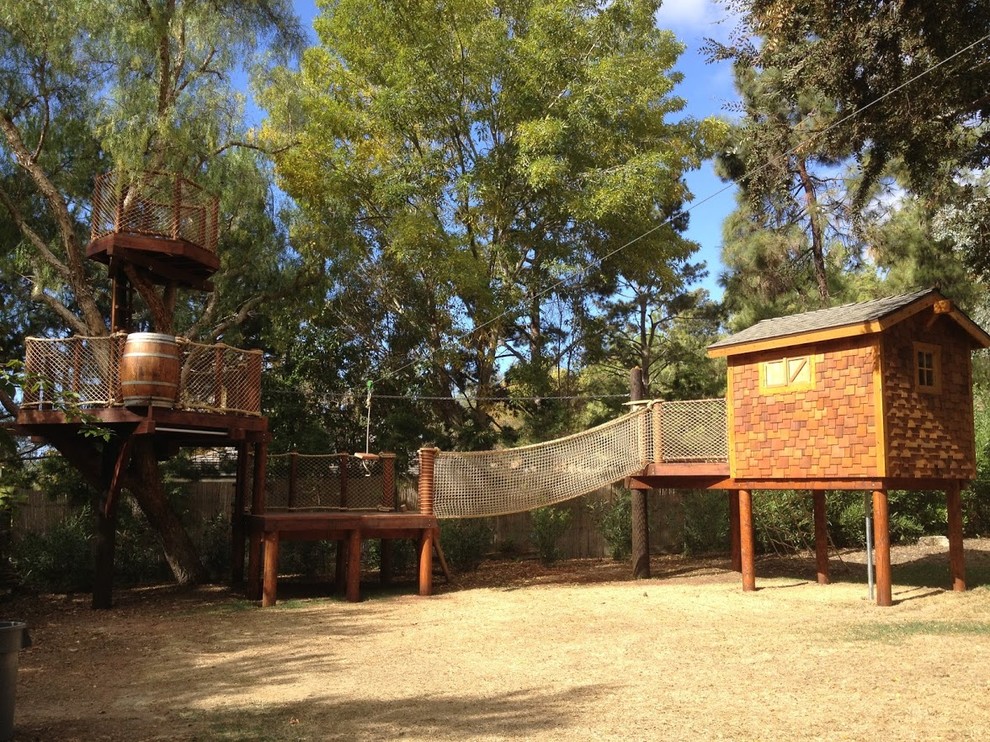 Mid-sized arts and crafts garden in San Diego with with outdoor playset.