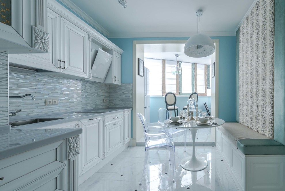 This is an example of a traditional l-shaped separate kitchen in Moscow with an undermount sink, raised-panel cabinets, white cabinets, grey splashback, no island and white floor.