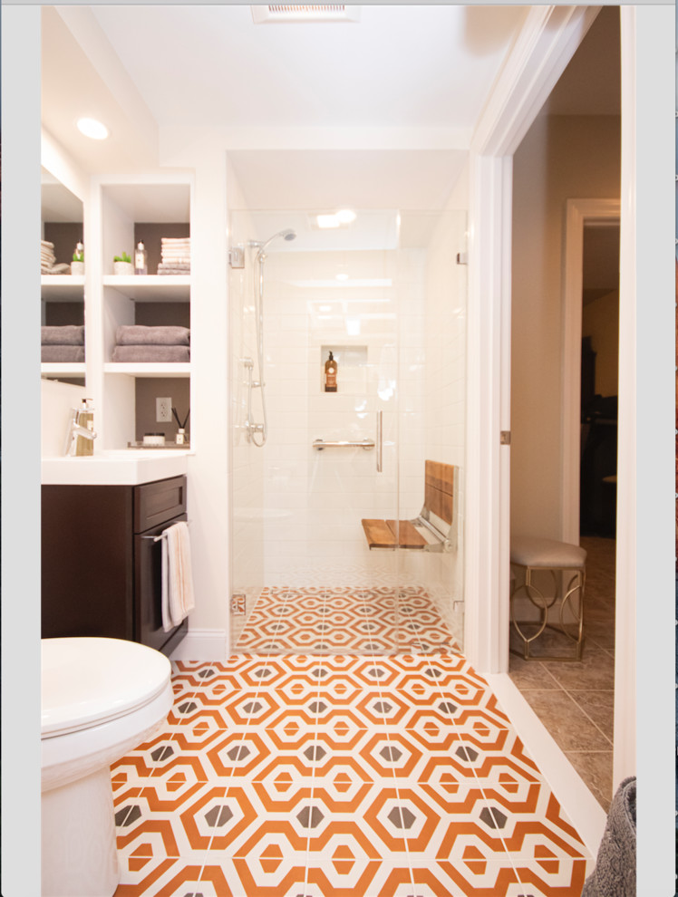 Photo of a small eclectic master bathroom in Providence with recessed-panel cabinets, dark wood cabinets, a curbless shower, a two-piece toilet, white tile, subway tile, beige walls, mosaic tile floors, a drop-in sink, orange floor and a hinged shower door.