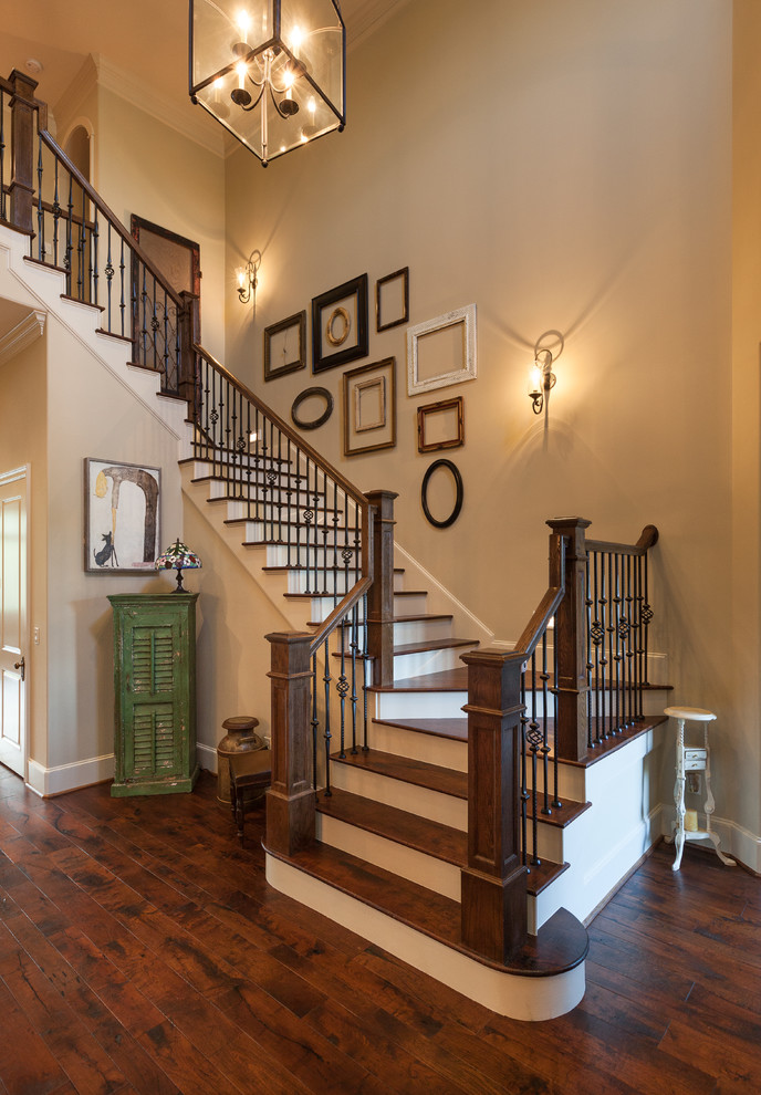 Design ideas for a traditional wood u-shaped staircase in Houston with painted wood risers.
