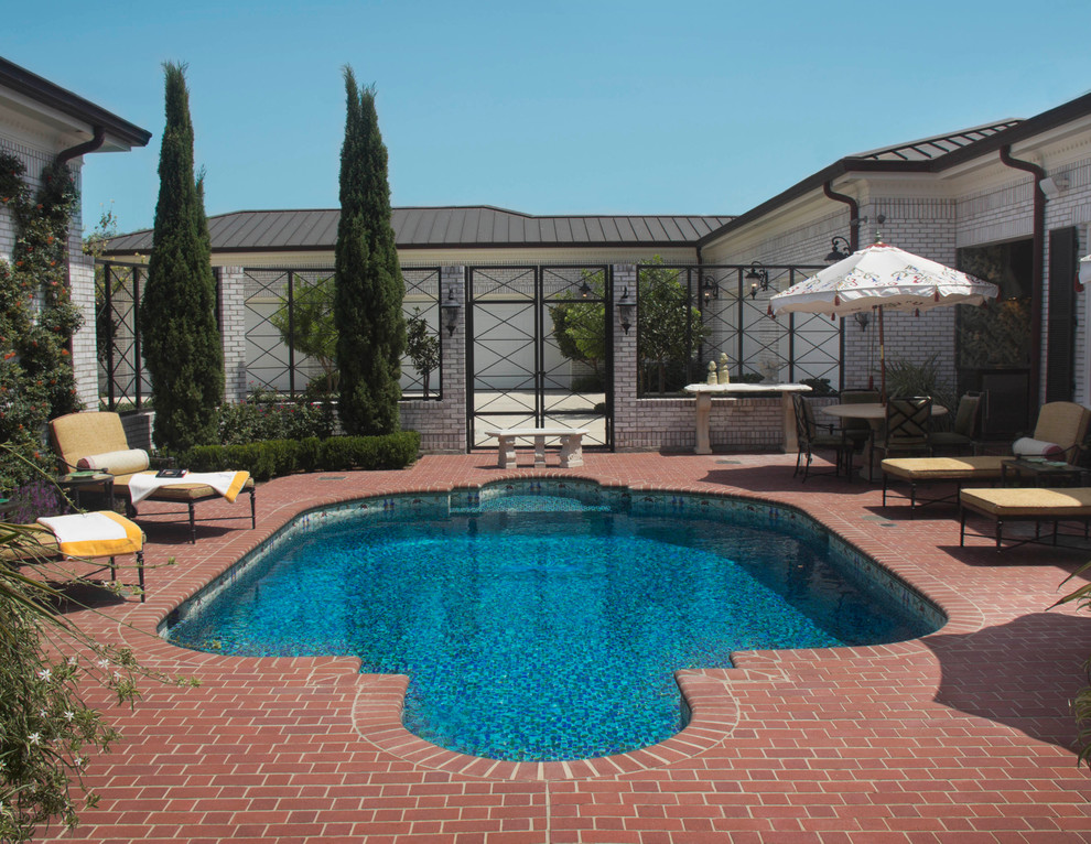 Transitional pool photo in Austin