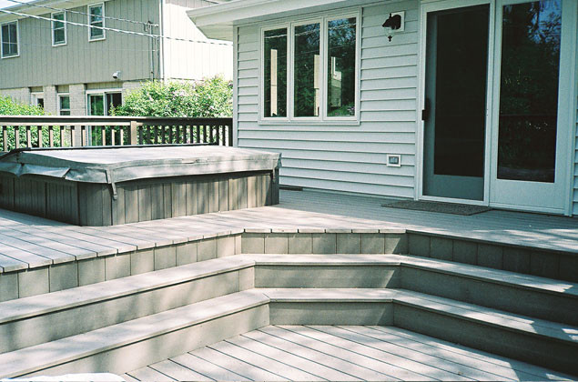 Small mountain style backyard deck photo in Chicago