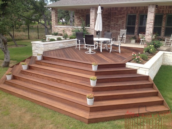 Ipe Hardwood Decking with Metal Framing, Limestone Flower Beds around ...