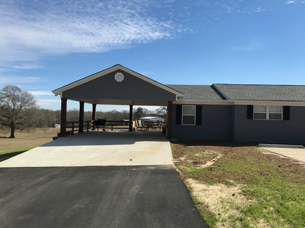 Mid-sized mountain style blue one-story wood gable roof photo with a shingle roof