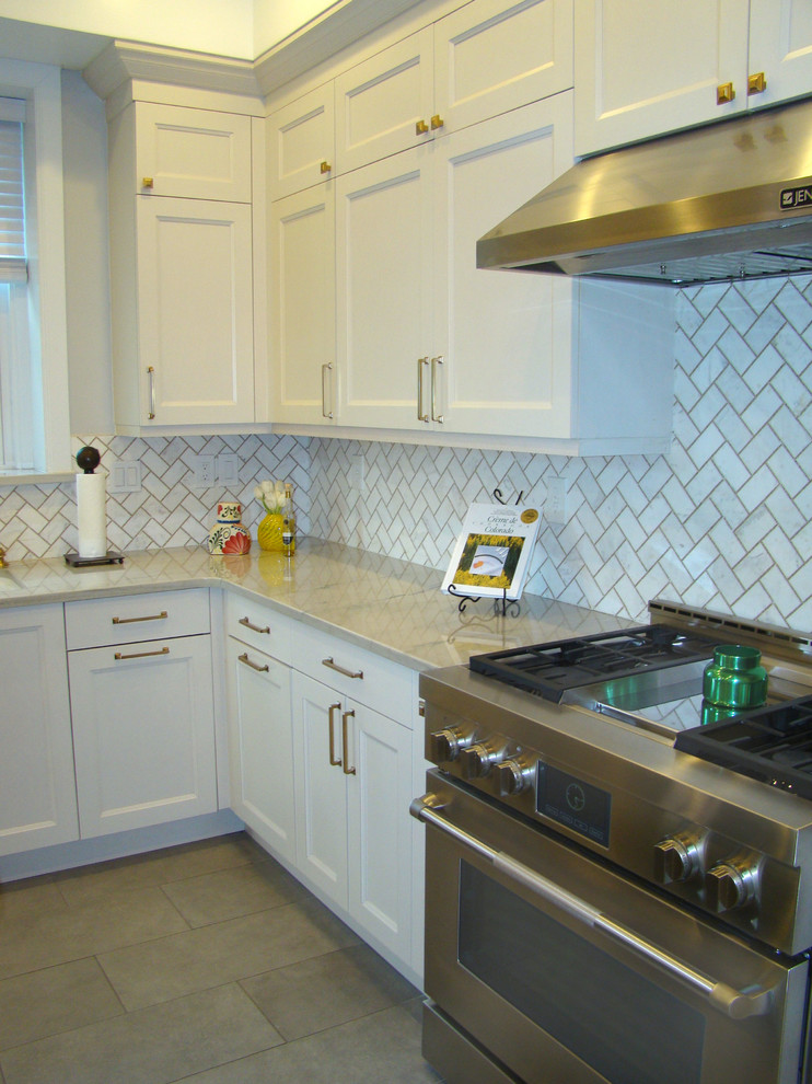 Large transitional u-shaped ceramic tile and gray floor eat-in kitchen photo in Denver with a double-bowl sink, recessed-panel cabinets, white cabinets, granite countertops, white backsplash, marble backsplash, stainless steel appliances, an island and multicolored countertops
